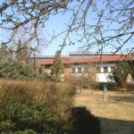 Dach in Tonziegeleindeckung, Fassaden in Schiefer